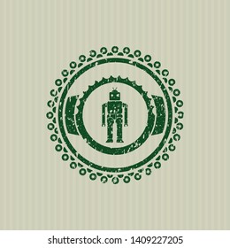 Green robot icon inside distressed rubber stamp with grunge texture