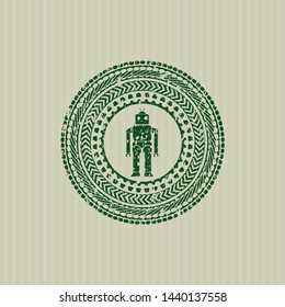 Green robot icon inside distressed grunge stamp