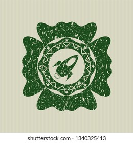 Green rocket icon inside distressed grunge seal