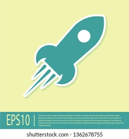 Green Rocket ship with fire icon isolated on yellow background. Space travel. Vector Illustration