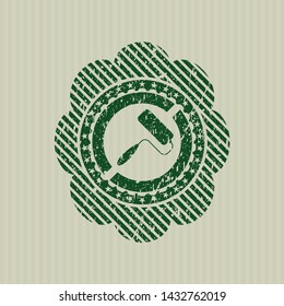 Green roller brush icon inside distress grunge stamp