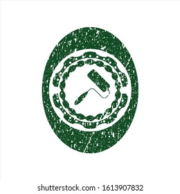 Green roller brush icon inside rubber grunge stamp