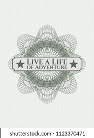 Green rosette (money style emblem) with text Live a Life of Adventure inside
