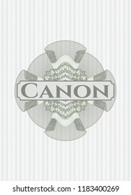 Green rosette or money style emblem with text Canon inside