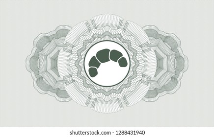Green rosette (money style emblem) with croissant icon inside