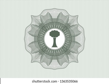 Green rosette or money style emblem with tree icon inside