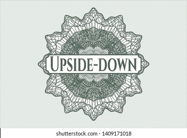 Green rosette (money style emblem) with text Upside-down inside