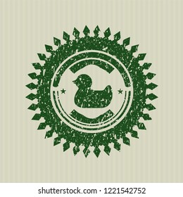 Green rubber duck icon inside rubber grunge texture stamp