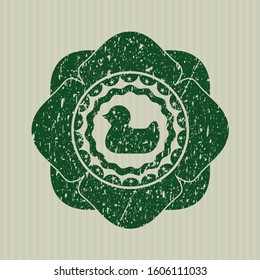 Green rubber duck icon inside rubber texture