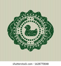 Green rubber duck icon inside rubber grunge texture stamp