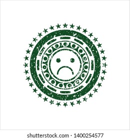 Green sad face icon inside distress rubber grunge texture seal