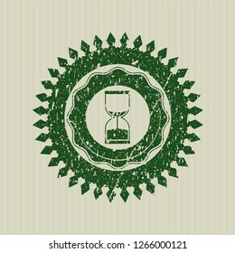 Green sand clock icon inside distress rubber stamp