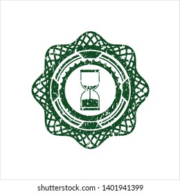 Green sand clock icon inside grunge style stamp