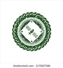 Green satelite icon inside distress rubber grunge stamp