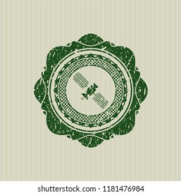 Green satelite icon inside distressed grunge stamp