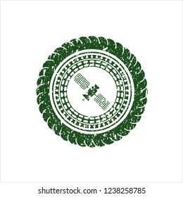 Green satelite icon inside distressed rubber grunge stamp