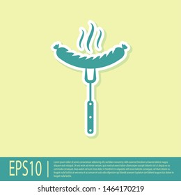 Green Sausage on the fork with steam icon isolated on yellow background. Grilled sausage and aroma sign. Vector Illustration