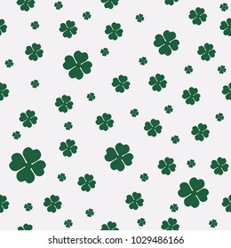 Green seamless pattern with four and tree leaf clovers for Saint Patrick's Day. Vector illustration