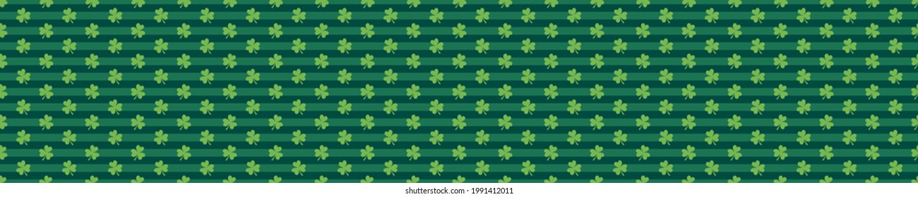 Green seamless pattern with stripes and clovers