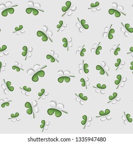 Green seamless pattern with white leaf clover design.