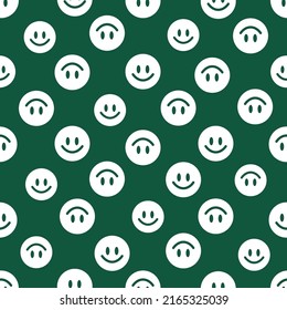 Green seamless pattern with white smiley faces.