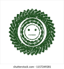 Green serious face icon inside distressed rubber stamp