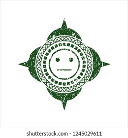 Green serious face icon inside distressed rubber seal with grunge texture