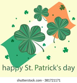 green Shamrock, the flag, the words happy St. Patrick's day on light background