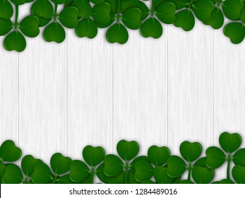 Green shamrock leaves decorated on wooden texture background for St. Patrick's Day celebration template design.