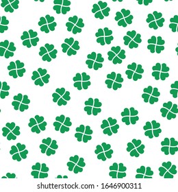 Green shamrock seamless pattern. Background of fourleaf clovers. Simple flat vector illustration.
