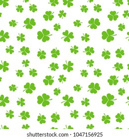 Green shamrocks or clovers on white background vector seamless pattern
