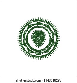 Green shield icon inside distress grunge seal