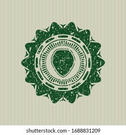 Green shield icon with rubber seal texture