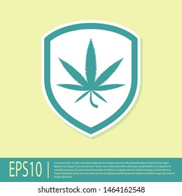 Green Shield and marijuana or cannabis leaf icon isolated on yellow background. Marijuana legalization. Hemp symbol.  Vector Illustration