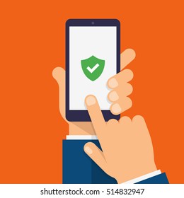 Green Shield On Smartphone Screen. Hand Holds The Smartphone And Finger Touches Screen. Modern Flat Design Illustration.