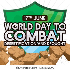 Green shield protecting water and trees over barren ground as symbol to fight desertification during World Day to Combat Desertification and Drought this 17th June.
