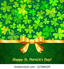Green shining clovers Saint Patrick's Day greeting card with sign and golden ribbon