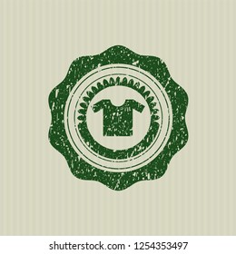 Green shirt icon inside distressed rubber grunge seal