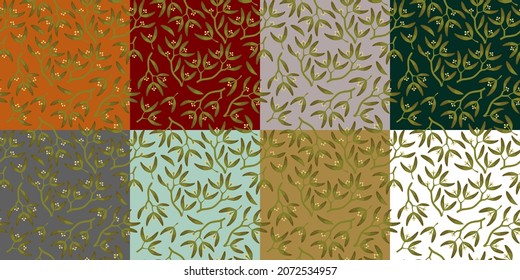 Green shoots, leaves, buds, mistletoe berries on a Christmas background. Plant background suitable for winter and seasonal festivities decoration.