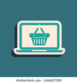 Green Shopping basket on screen laptop icon isolated on blue background. Concept e-commerce, e-business, online business marketing. Long shadow style. Vector Illustration