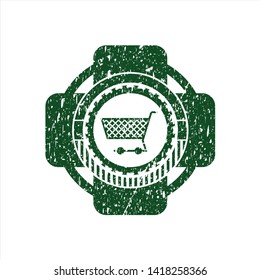 Green shopping cart icon inside distress rubber seal