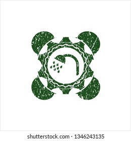 Green shower icon inside distressed rubber stamp with grunge texture