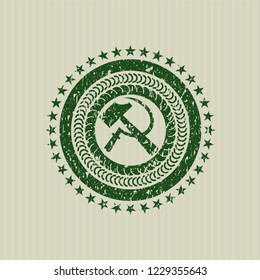 Green sickle and hammer icon inside distress rubber grunge texture seal