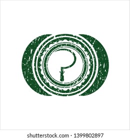 Green sickle icon inside distress rubber seal