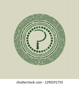 Green sickle icon inside distressed grunge stamp
