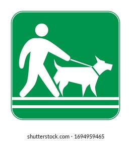 Green sign, man walking with a dog on a leash. Prohibiting and resolving signs.