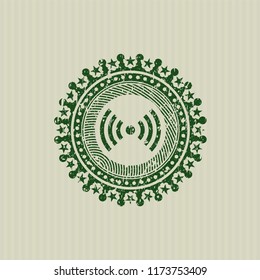 Green signal icon inside rubber seal