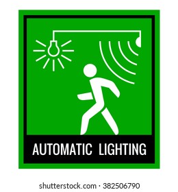 Green signboard of a automatic lighting system information. Walk forward sign.