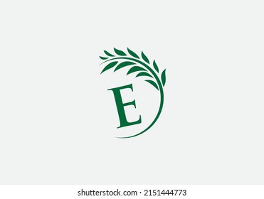 Vector del logo de la corona de laurel verde y único con letras y alfabetos