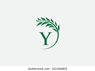 Vector del logo de la corona de laurel verde y único con letras y alfabetos